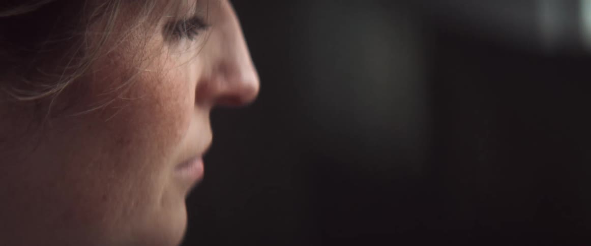 A profile of a woman with freckles