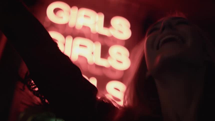 A woman partying outside a club
