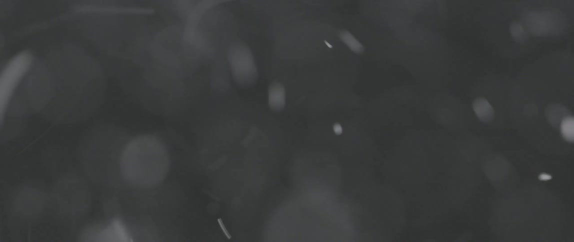 Snow is falling in a blurry area