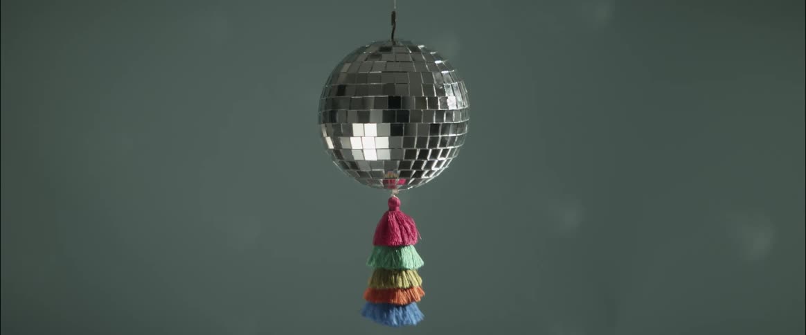 A disco ball spinning and reflecting light
