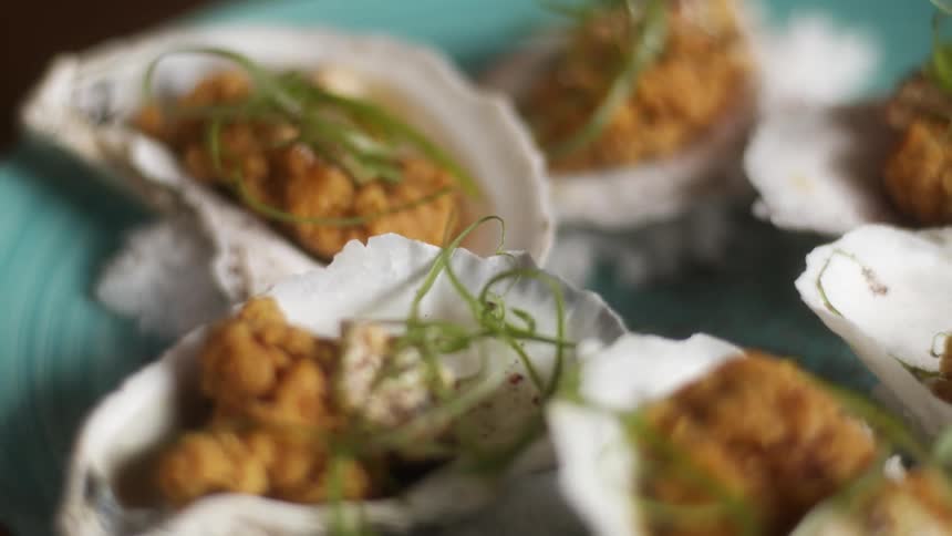 The plate is full of baked clams