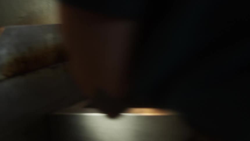 A man cooks in a restaurant kitchen
