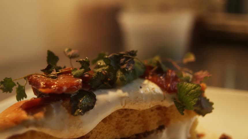 Close up of the topping of a dish served on a restaurant