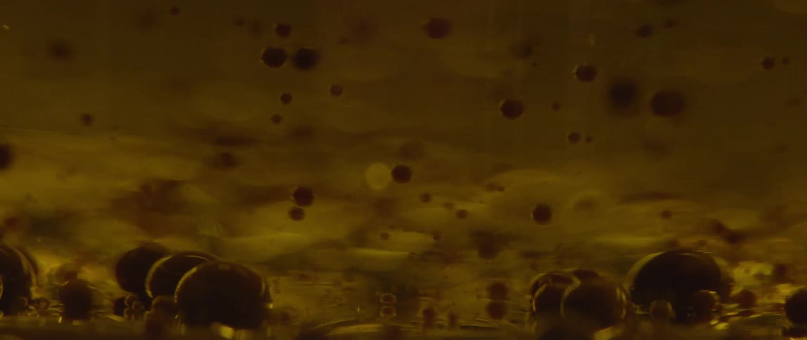 Bubbles swirling and floating in a substance