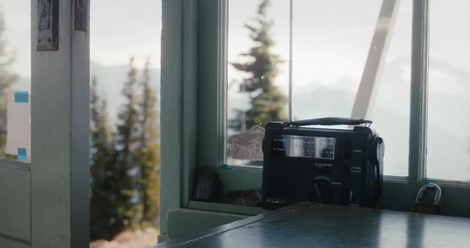 Old radio on window lane next to open door