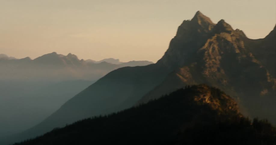 Mountains with peaks in a hazy sky