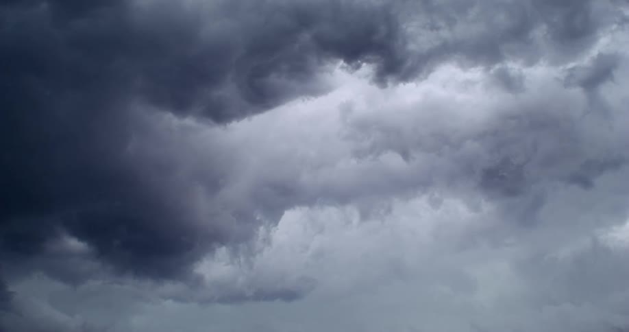 Storm clouds roll across the sky