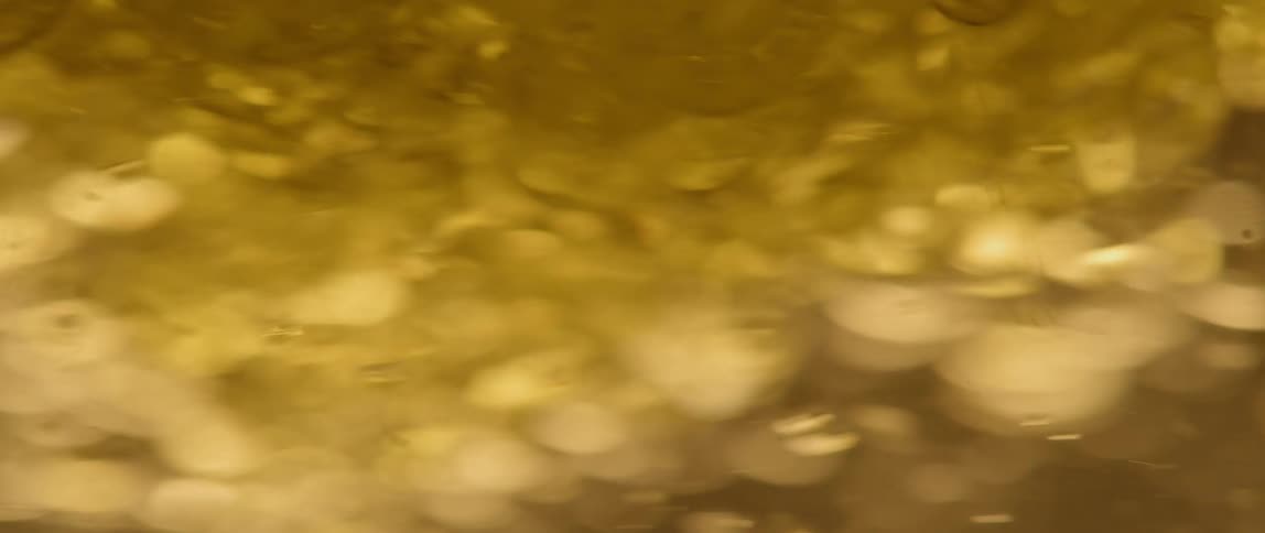 Fast-moving bubbles in a golden liquid