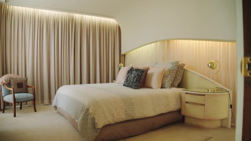 A neatly made bed in a bedroom