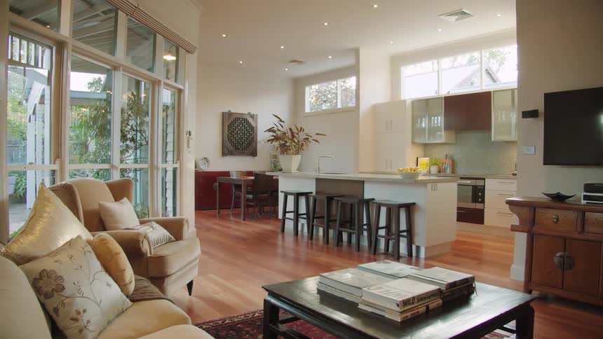 Living room with furniture and kitchen with island