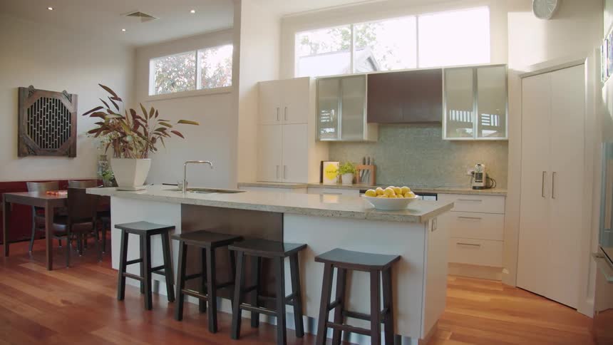 A modern kitchen has a mixture of textures and colors