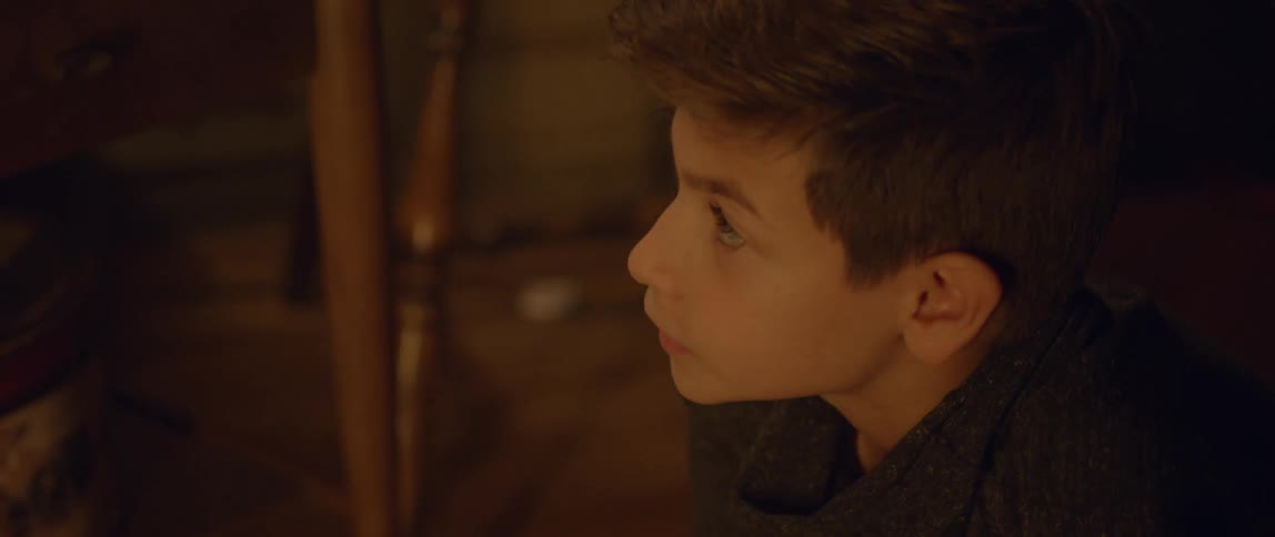 A boy looks up from the ground