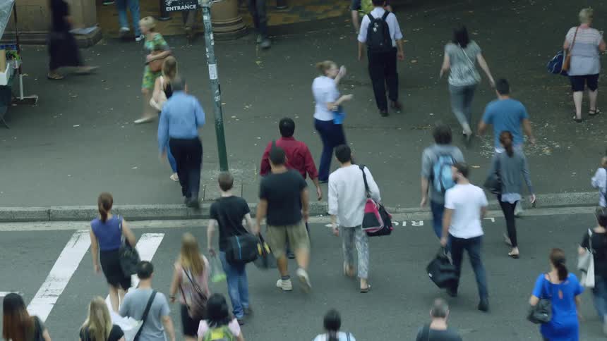 Groups of people crossing a road
