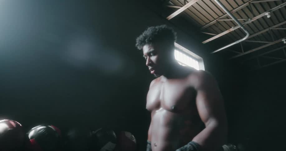 A man walks on his hands in the gym