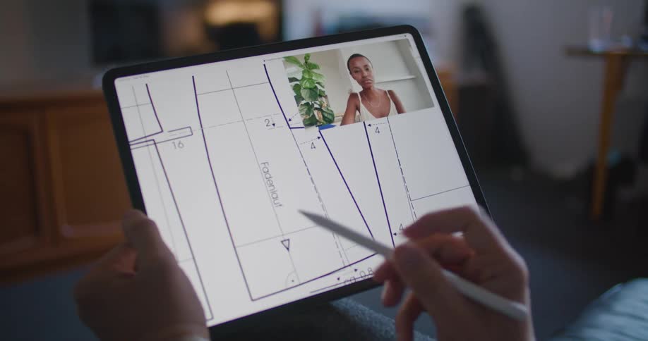 A person drawing on a tablet
