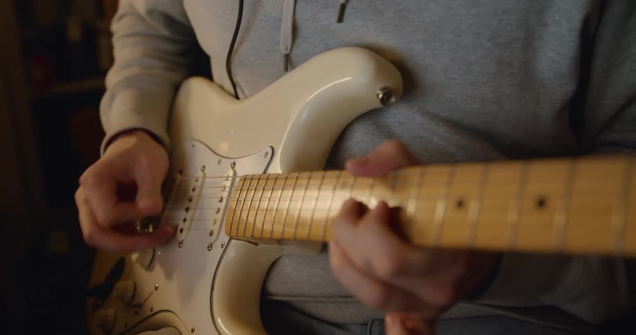 A man plays a guitar