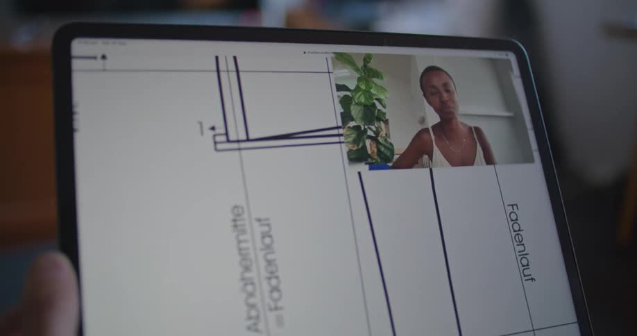Man holding stylus pen uses tablet while making video call