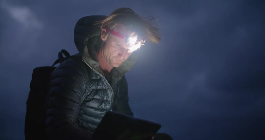 A man using a tablet outdoors