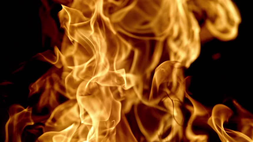 Flames are rising in the darkness