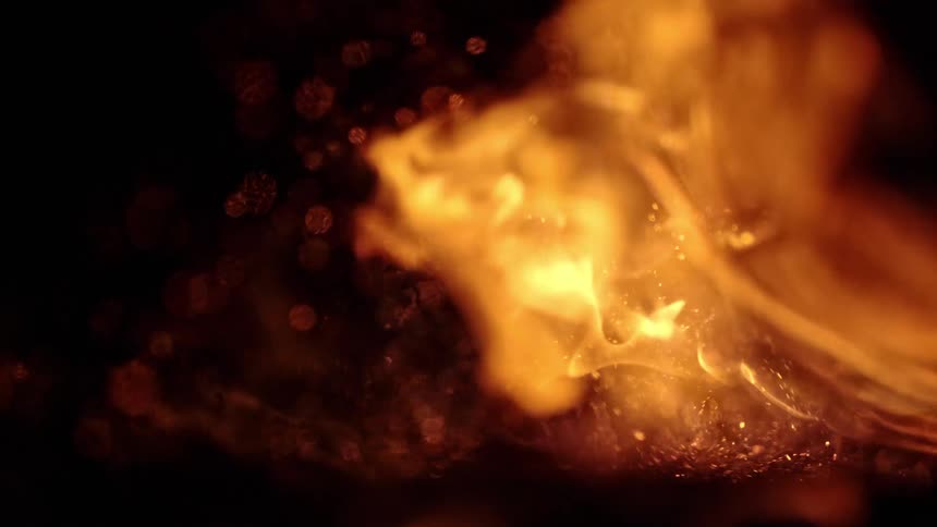 Fire embers and smoke burning firewood