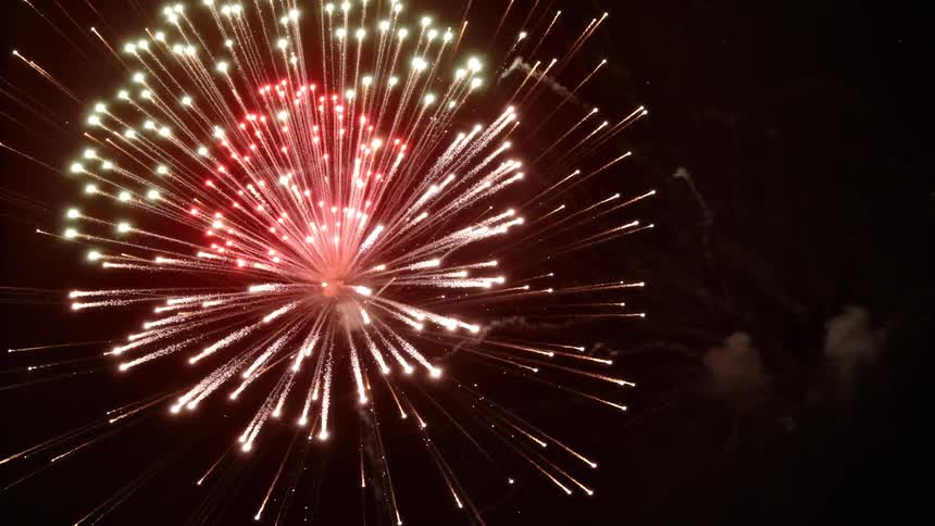 The fireworks explode all over the sky