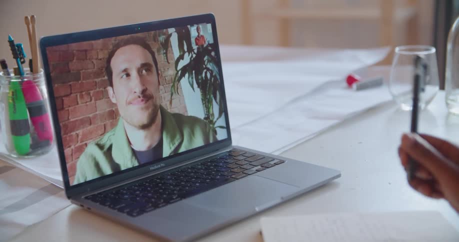 Person talking on laptop