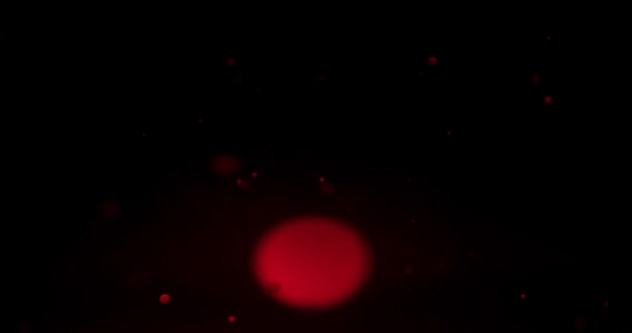 Red and black colors in liquid that look like a lava lamp