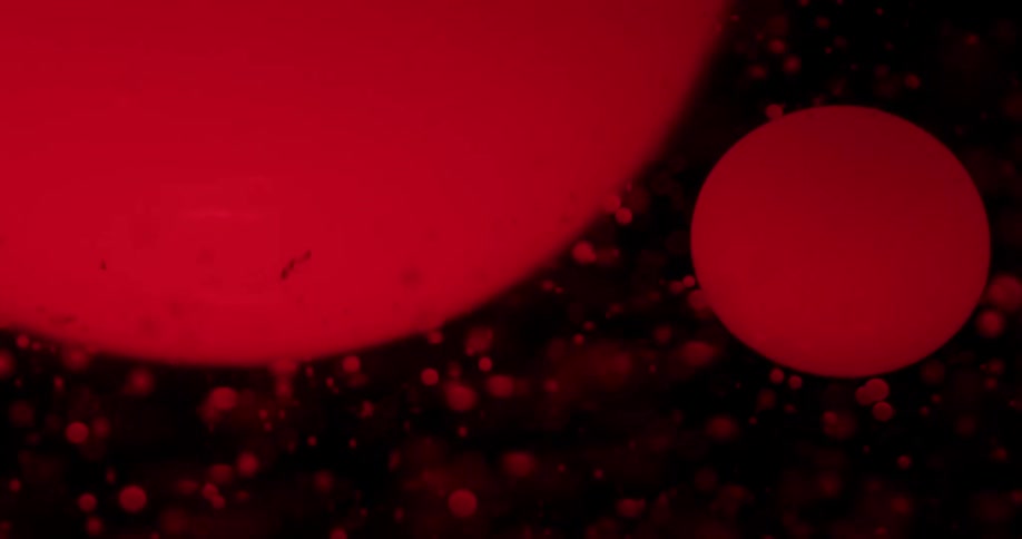 Red spheres float around and knock into each other