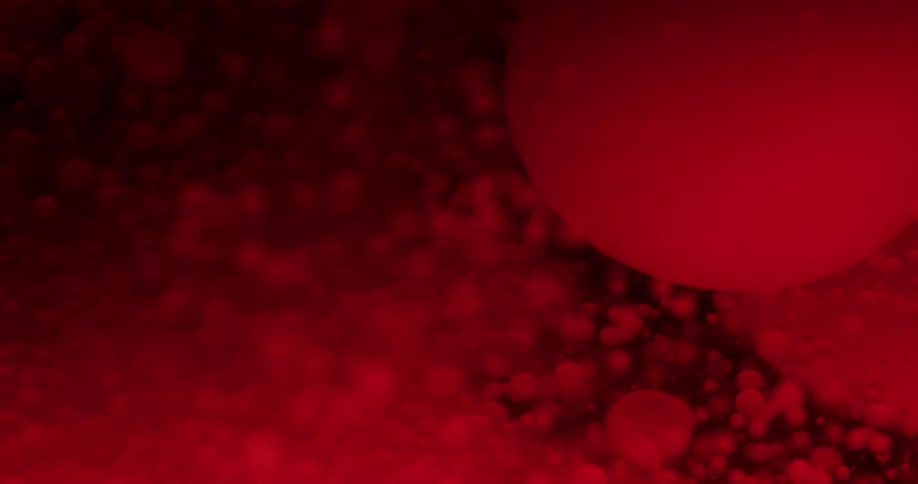 Spheres sink in liquid as bubbles float and glow red