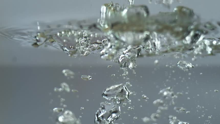A close up of something falling into water