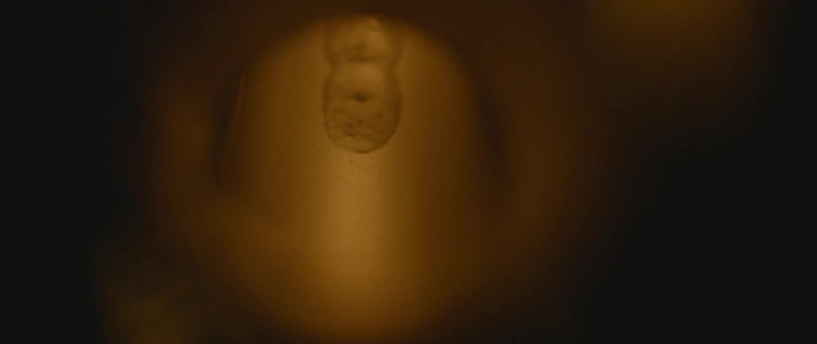 A yellow light flashes and bubbles