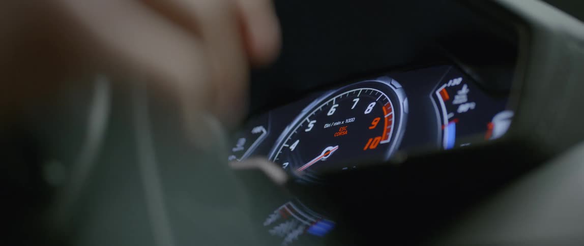 A car speedometer going up