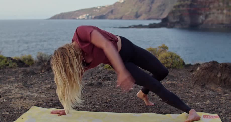 A woman doing yoga outdoors