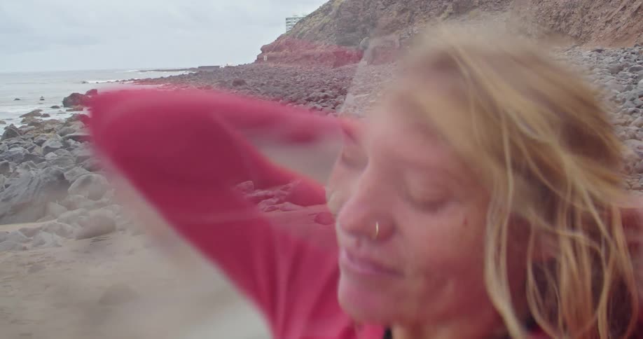 A woman stretching on the beach