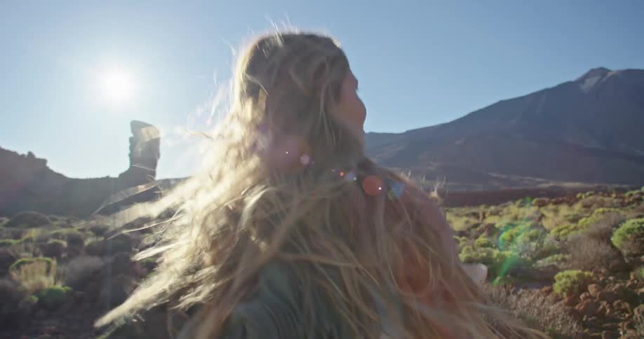 A woman hiking outdoors in the desert