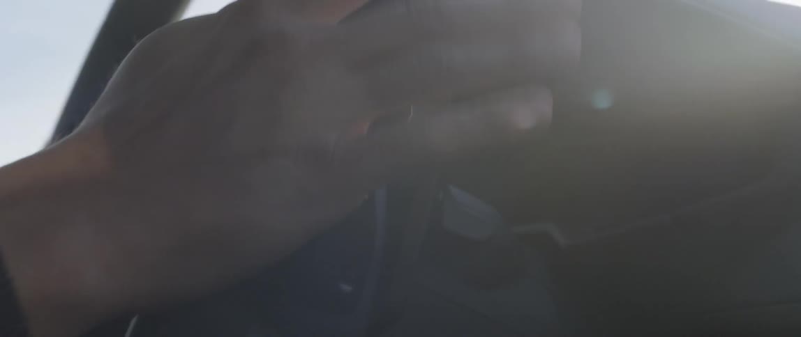 Close up of hands steering a vehicle wheel