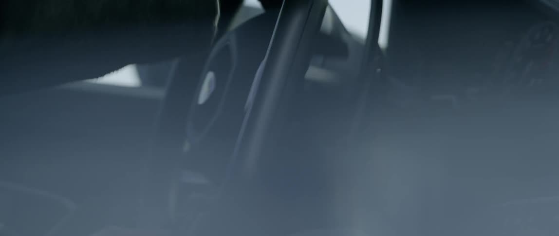 Close up of hands steering a vehicle