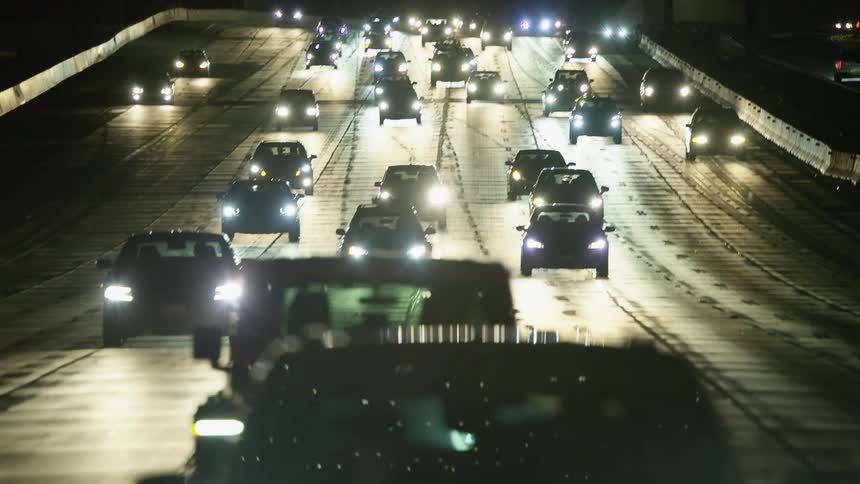 Headlights of cars driving on the highway at night