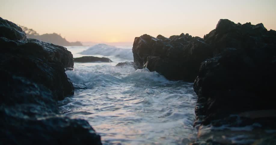 A view of water crashing on the shore