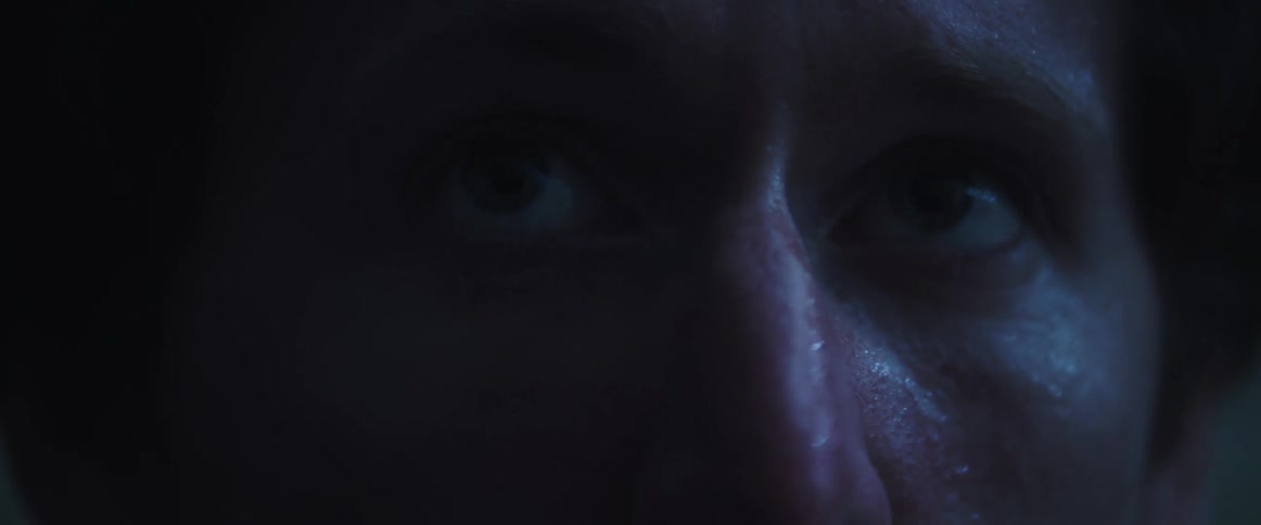 Man wakes up form a nightmare sweating and scared