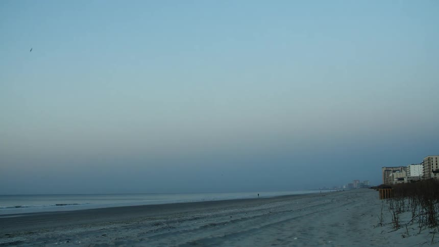Lonely beach near the ocean at evening