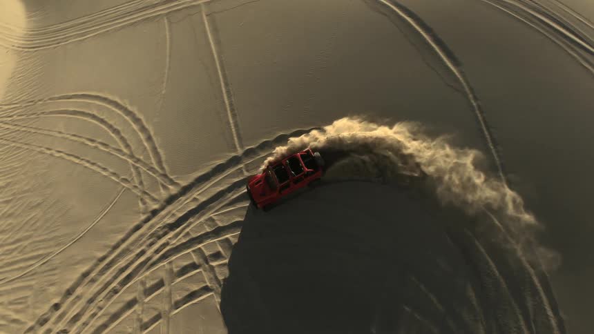 A person is driving their vehicle in an off road area
