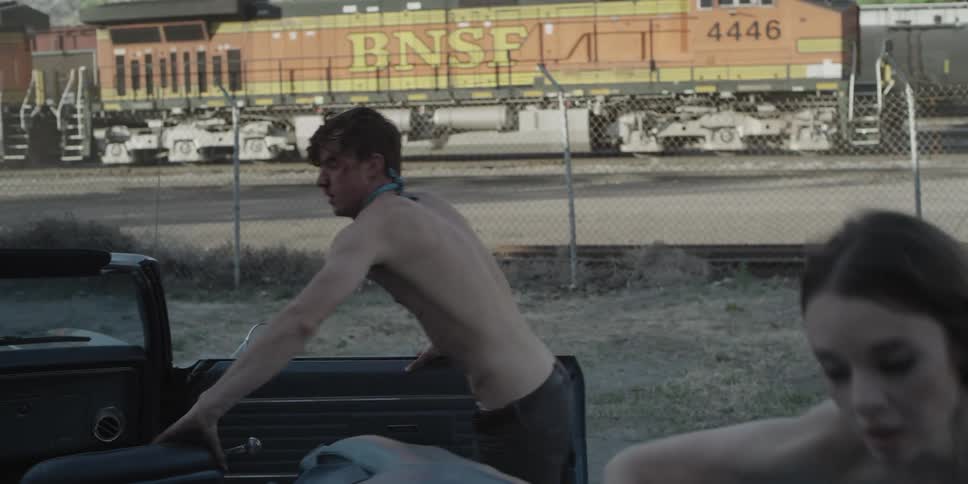 Young couple running away scared boarding a convertible car