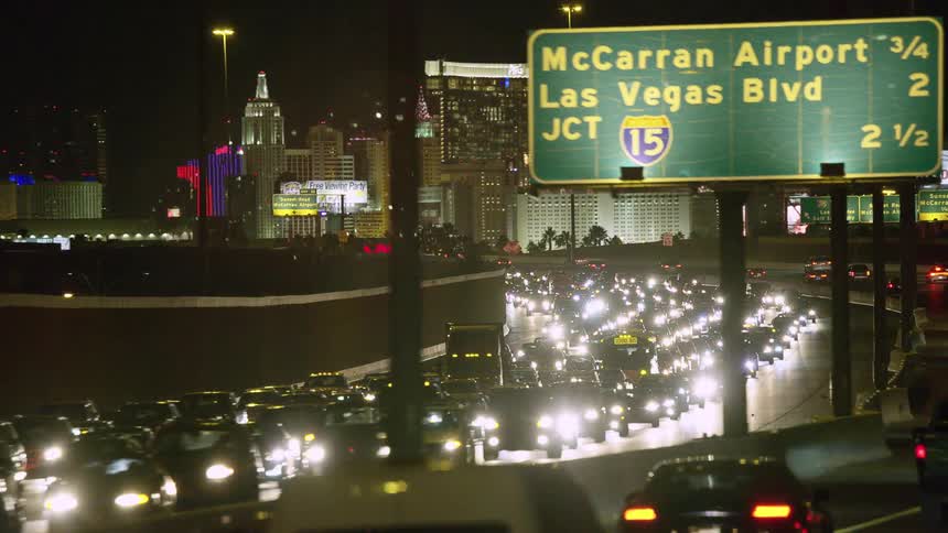 Vehicles driving on a very busy street at night