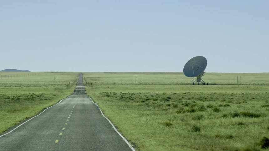 Rural road with nothing but a dish in the area
