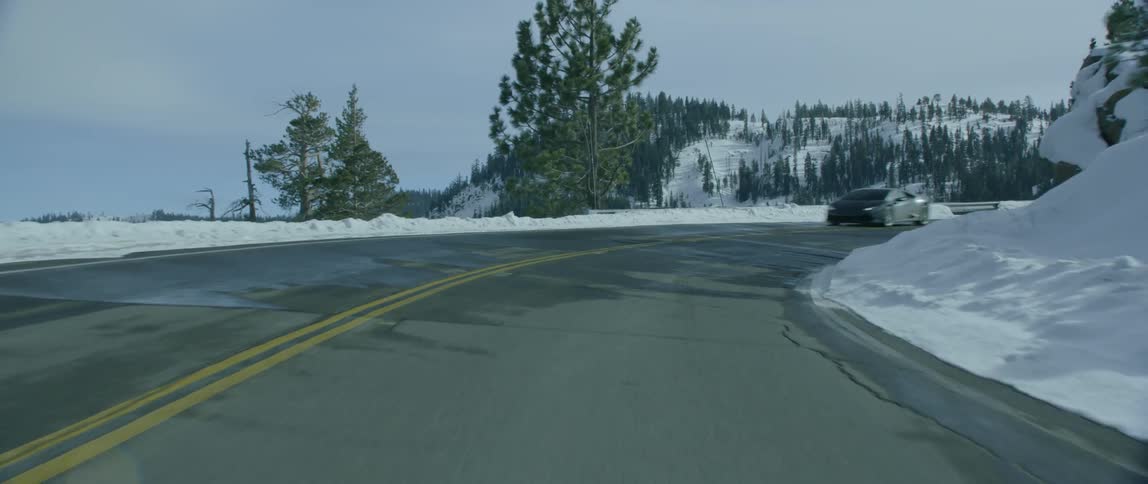 A sports car comes fast around a turn