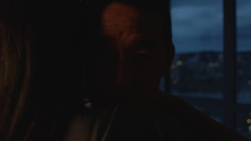 A couple dance together in their apartment