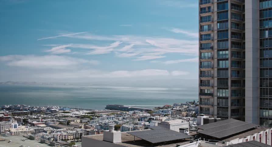 City apartment and buildings overlooking the calm sea