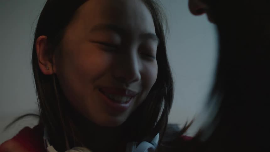 A mother hugging her daughter