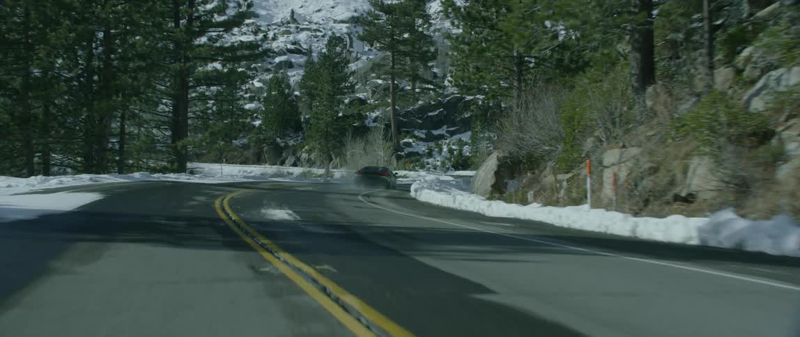 A car races off into steep turns ahead